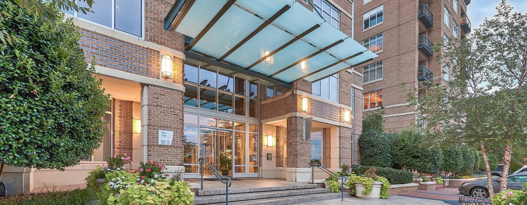 a building with a courtyard and trees