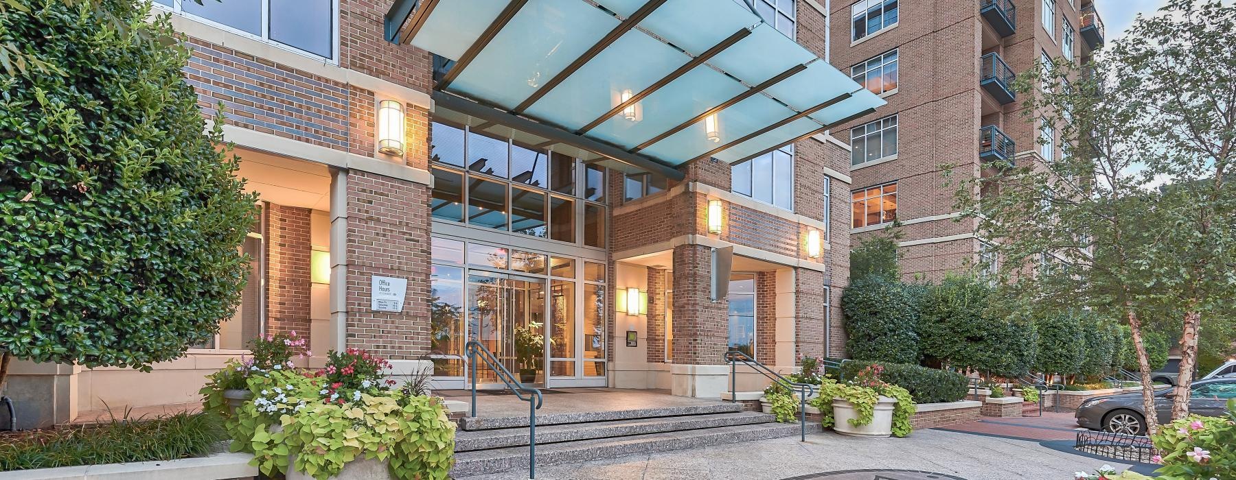 a building with a courtyard and trees