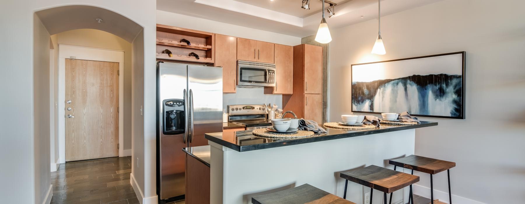 a kitchen with a bar stool