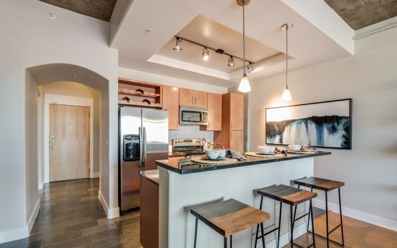 a kitchen with a bar stool