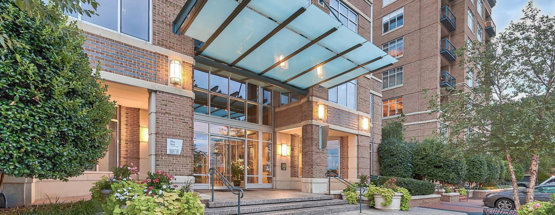 a building with a courtyard and trees