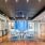 a room with a table chairs and a large glass ceiling
