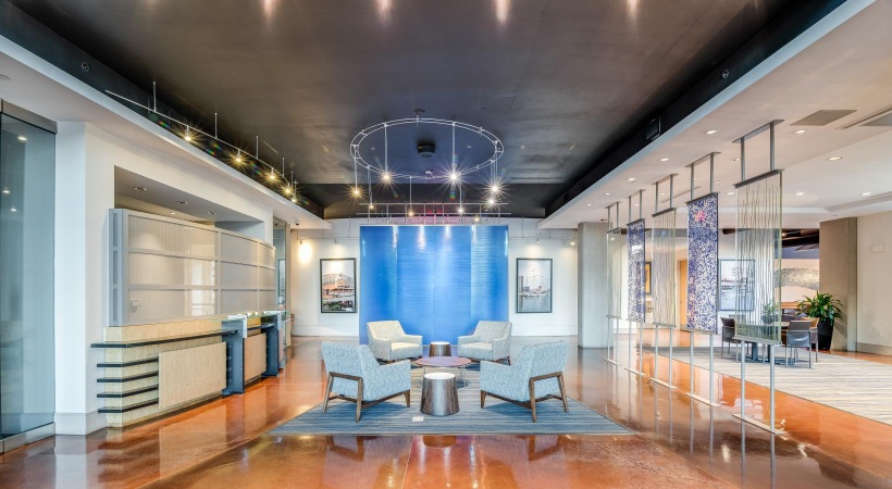 Thoughtful details to elevate your lifestyle a room with a table chairs and a large glass ceiling