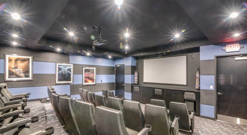 Access to resident-only features a room with chairs and a screen