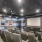 a room with chairs and a screen