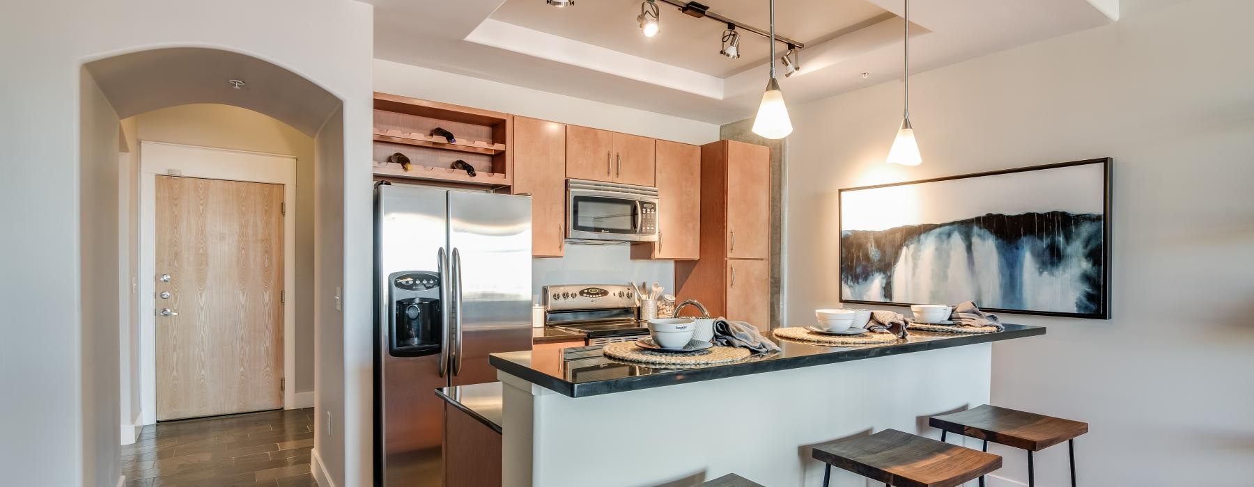 a kitchen with a bar stool