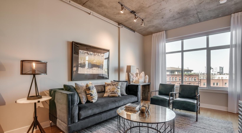 Spacious and well-lit living spaces a living room with a couch and a coffee table